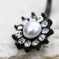 Piercing nombril acier noir fleur perle