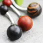 Piercing nombril boules en bois