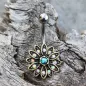 Piercing nombril fleur dorée aurore boréale
