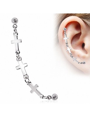 Double piercing cartilage oreille étoile croix