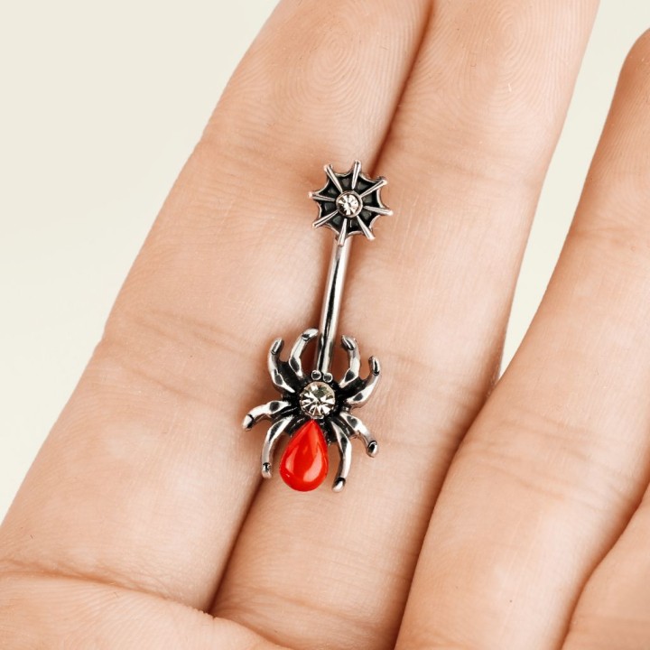 Piercing nombril araignée rouge et toile