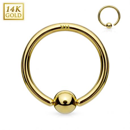 Piercing anneau boule fixée en or jaune 14 carats