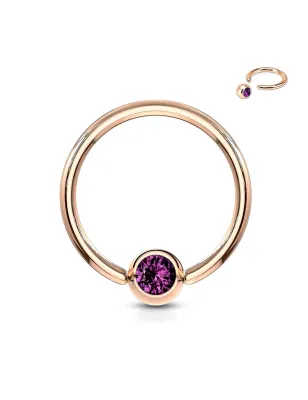 Piercing anneau captif or rosé cristal violet