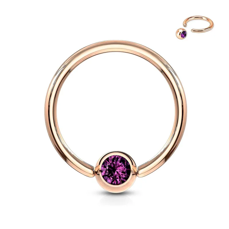 Piercing anneau captif or rosé cristal violet