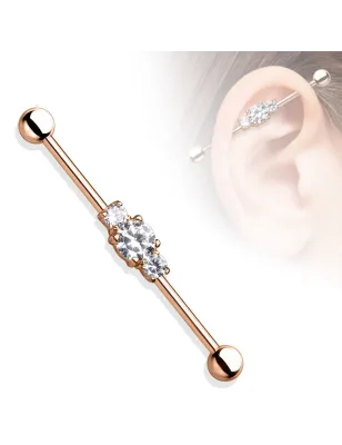 Piercing industriel oreille trois pierres acier chirurgical or rosé