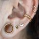 Piercing anneau oreille doré bordures perlées